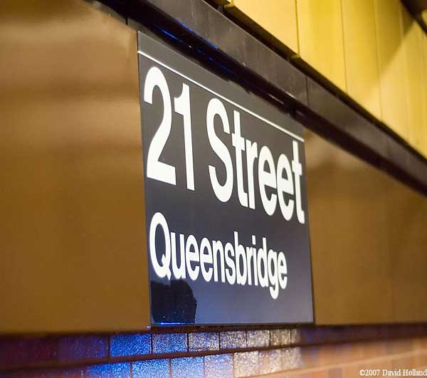 Station sign on the downtown platform at the 21st Street-Queensbridge station.